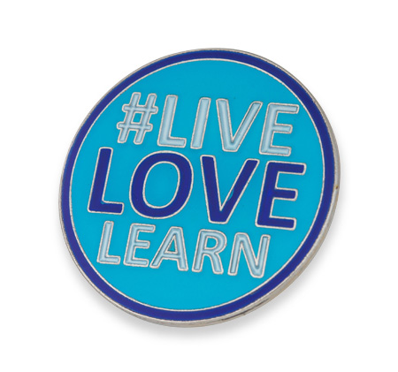 Light blue round enamel badge for #Live Love Learn